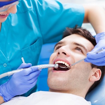 A young man gets his teeth cleaned
